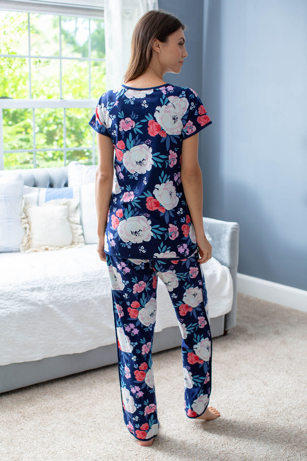 Maternity pajamas for hospital wear and beyond! Annabelle print with navy background, large cream flowers, blue petals, and smaller pink flowers. Feminine and stylish print to outfit the whole family.